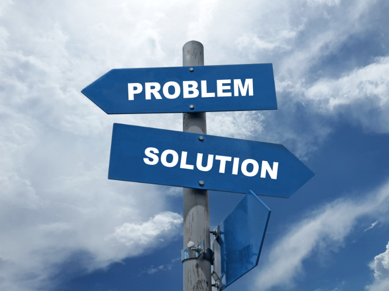 A Pole With Arrows on It Saying "Problem" and "Solution"