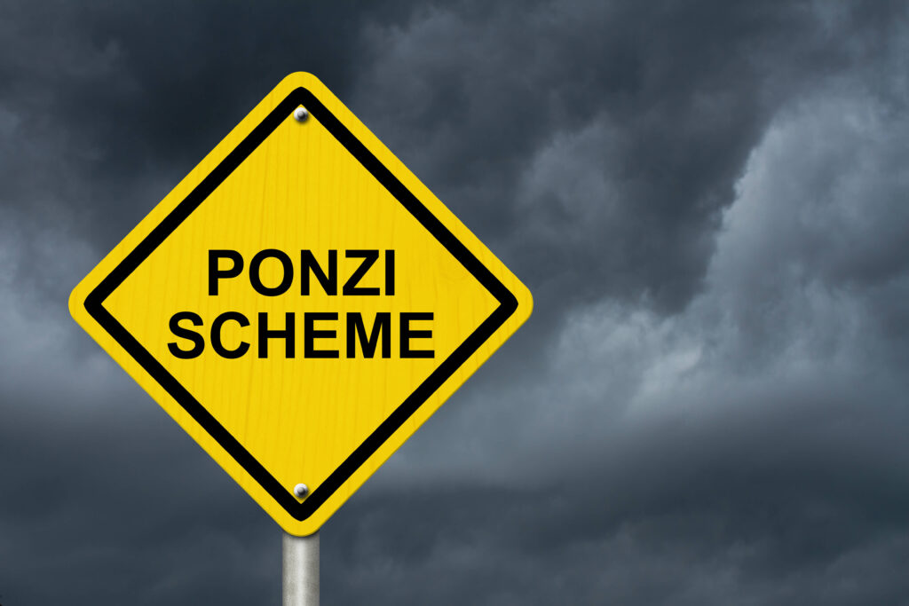 A yellow road sign that says Ponzi Scheme on it. Gray clouds in the background.